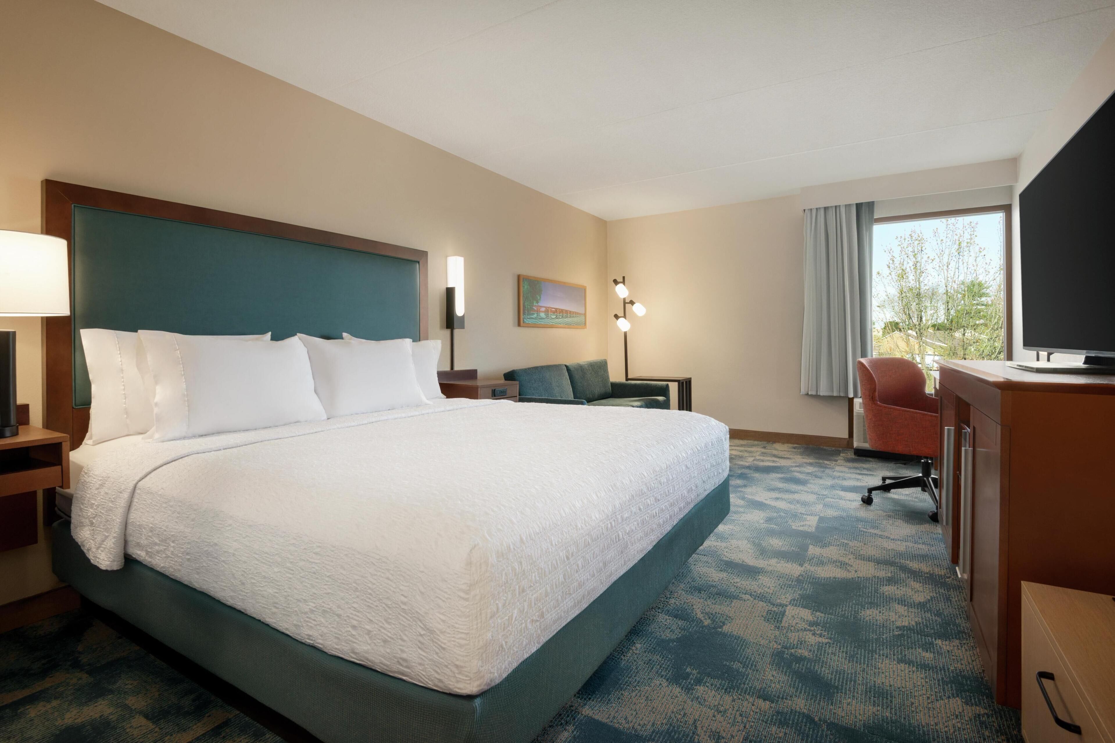 room, 1 king bed with sofa bed, refrigerator & microwave (shower) | premium bedding, pillow-top beds, individually decorated