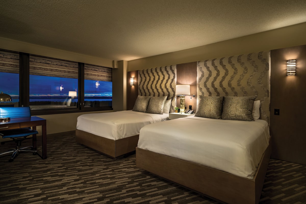Premium bedding, desk, laptop workspace, blackout curtains