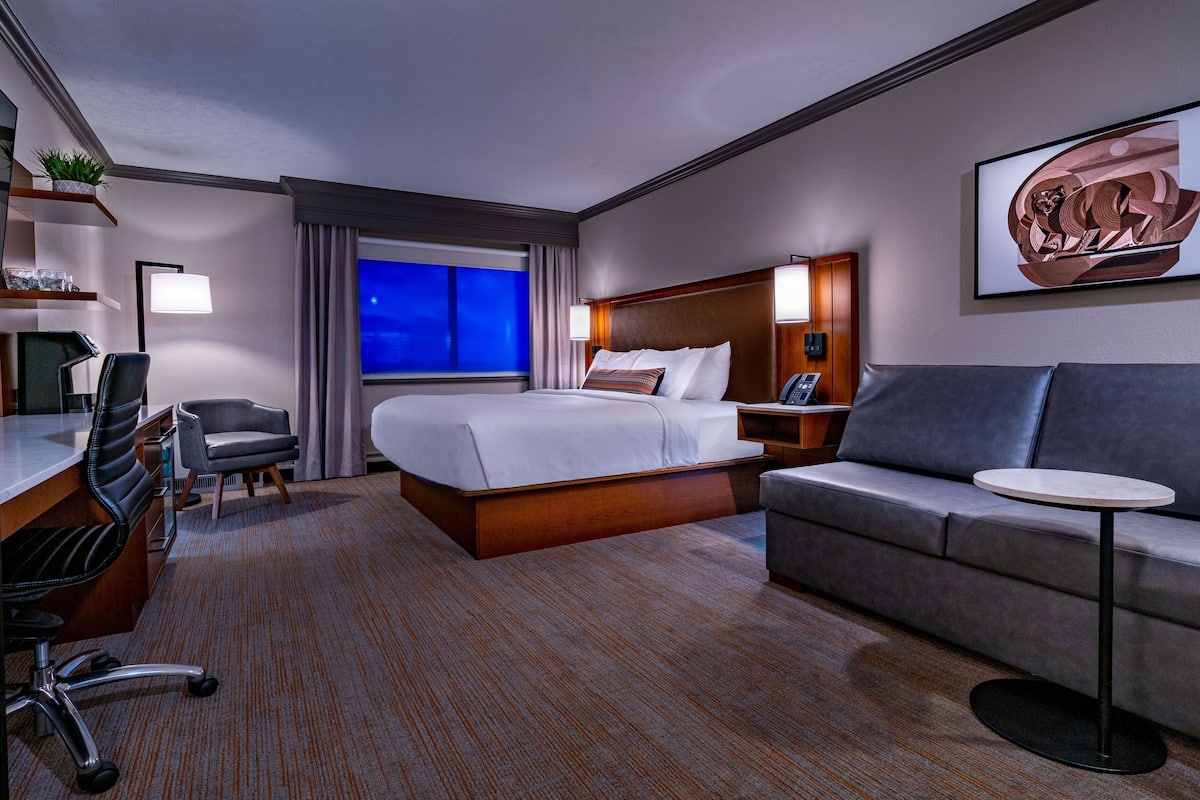 Premium bedding, desk, laptop workspace, blackout curtains