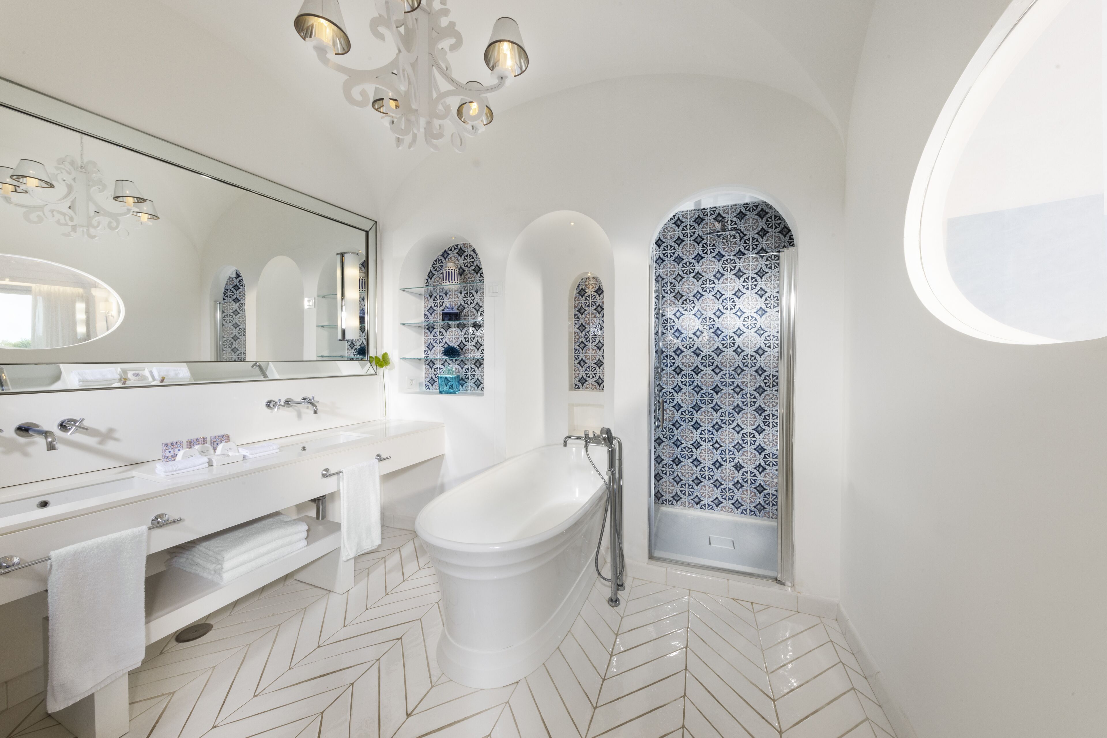 junior suite (sea side) | bathroom | separate bathtub and shower, rainfall showerhead, free toiletries