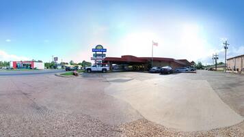 A Days Inn with a Thai restaurant, an auto parts store, and a gas station.