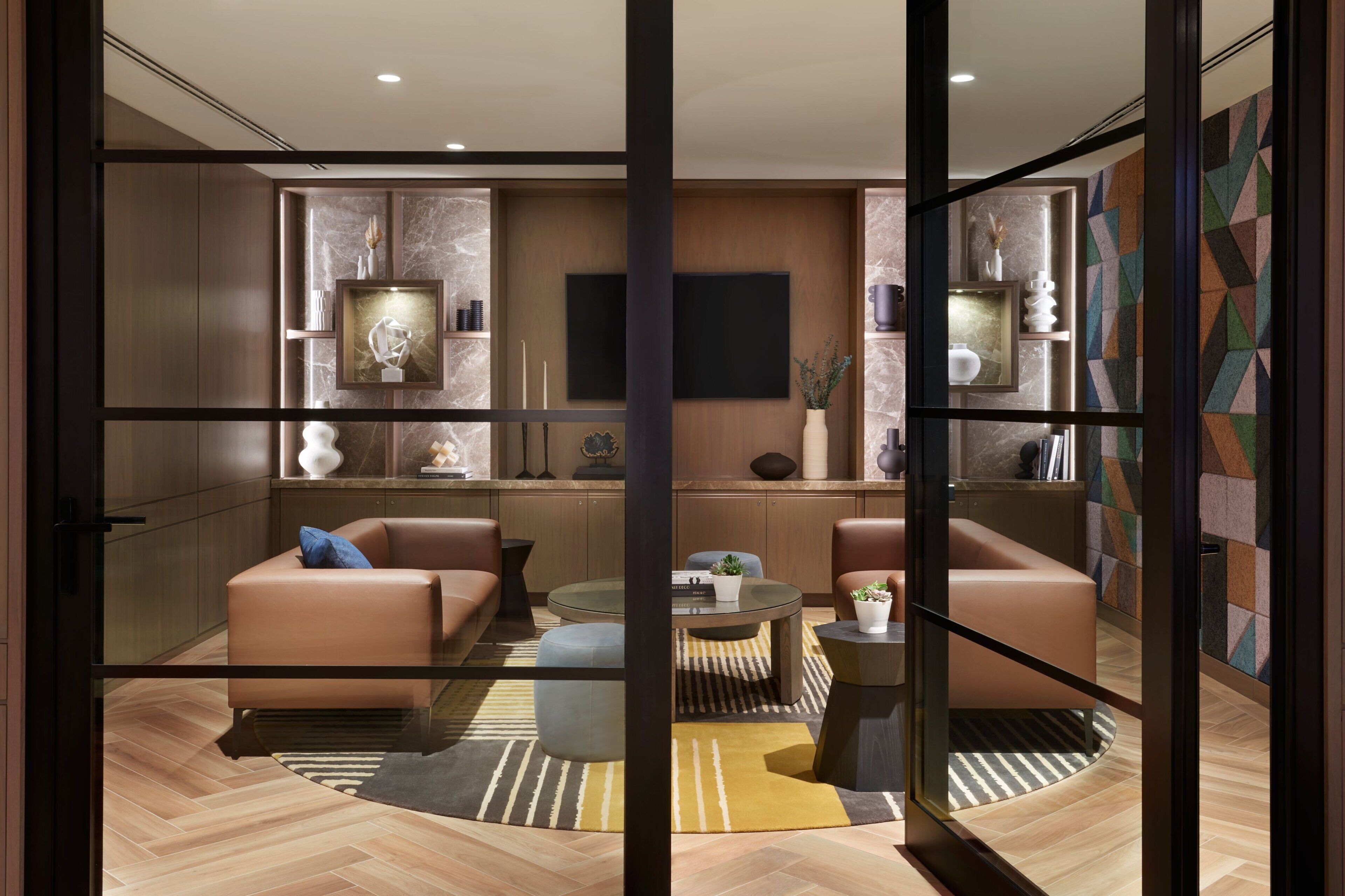 A modern living room with a sofa, coffee table, and decorative items.