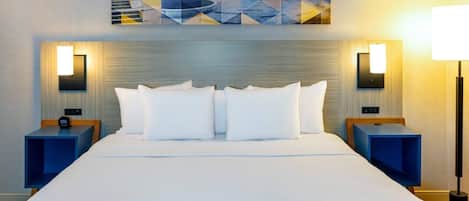 Premium bedding, pillow-top beds, desk, laptop workspace