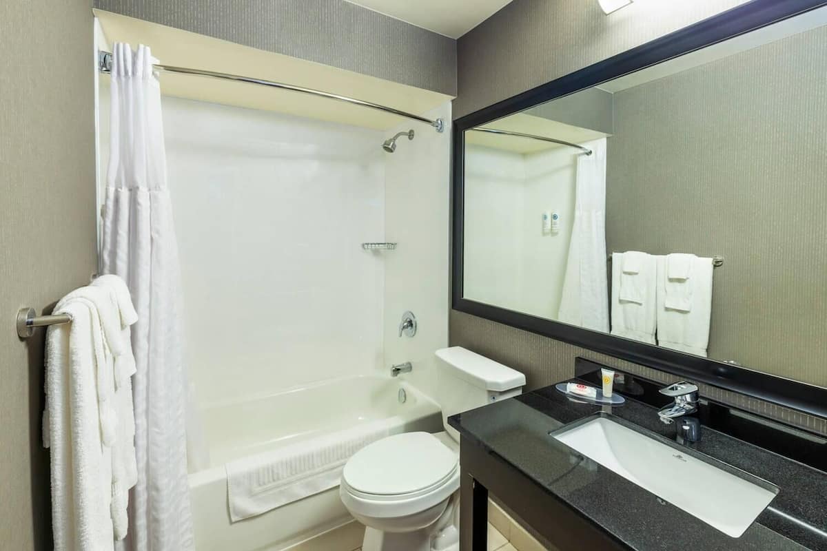 Premium bedding, pillow-top beds, desk, laptop workspace