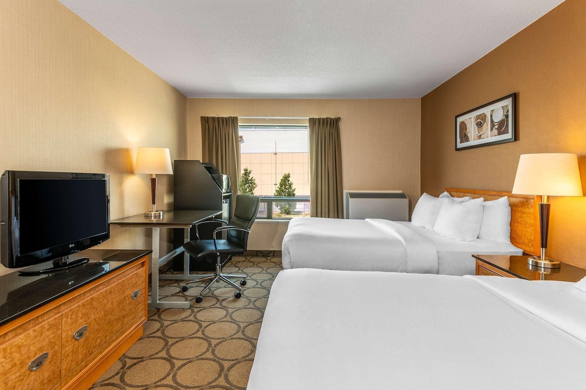 Premium bedding, pillow-top beds, desk, laptop workspace