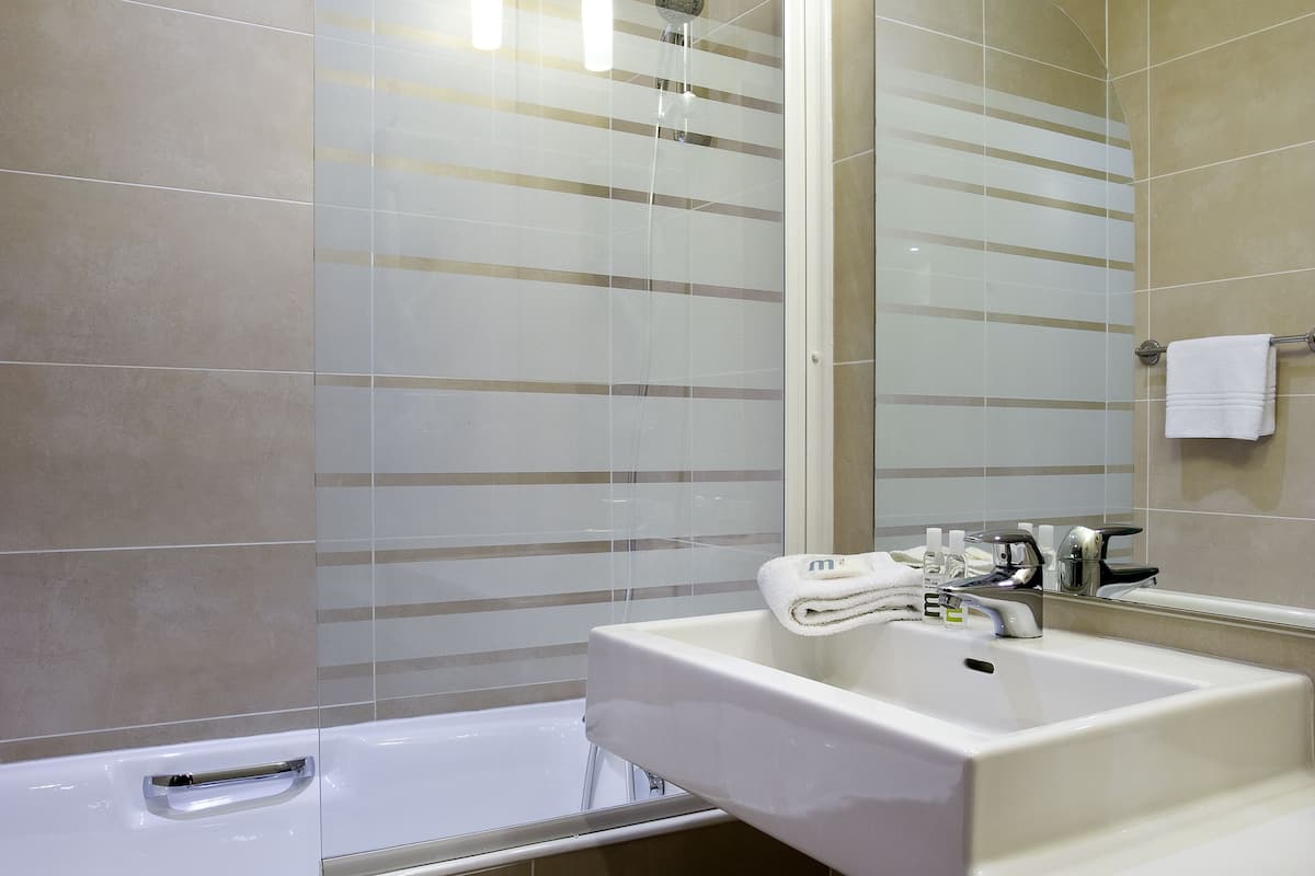 Eco-friendly toiletries, hair dryer, towels