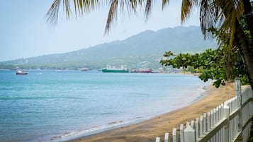 On the beach, black sand, beach massages, beach bar