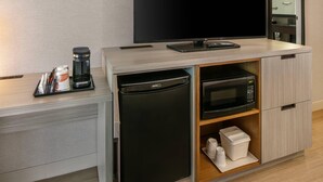 A compact kitchenette with a coffee maker, microwave, and a small refrigerator. - Comfort Inn (Yarmouth)