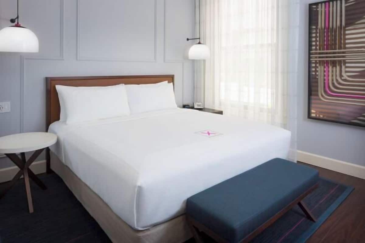 Premium bedding, down comforters, pillowtop beds, in-room safe