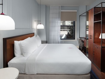 Room, 1 Queen Bed (ADA Communication) | Premium bedding, pillowtop beds, in-room safe, desk at Axiom Hotel