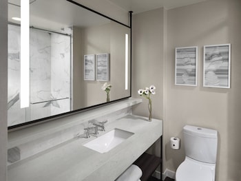 Shower, designer toiletries, hair dryer, bathrobes at Axiom Hotel