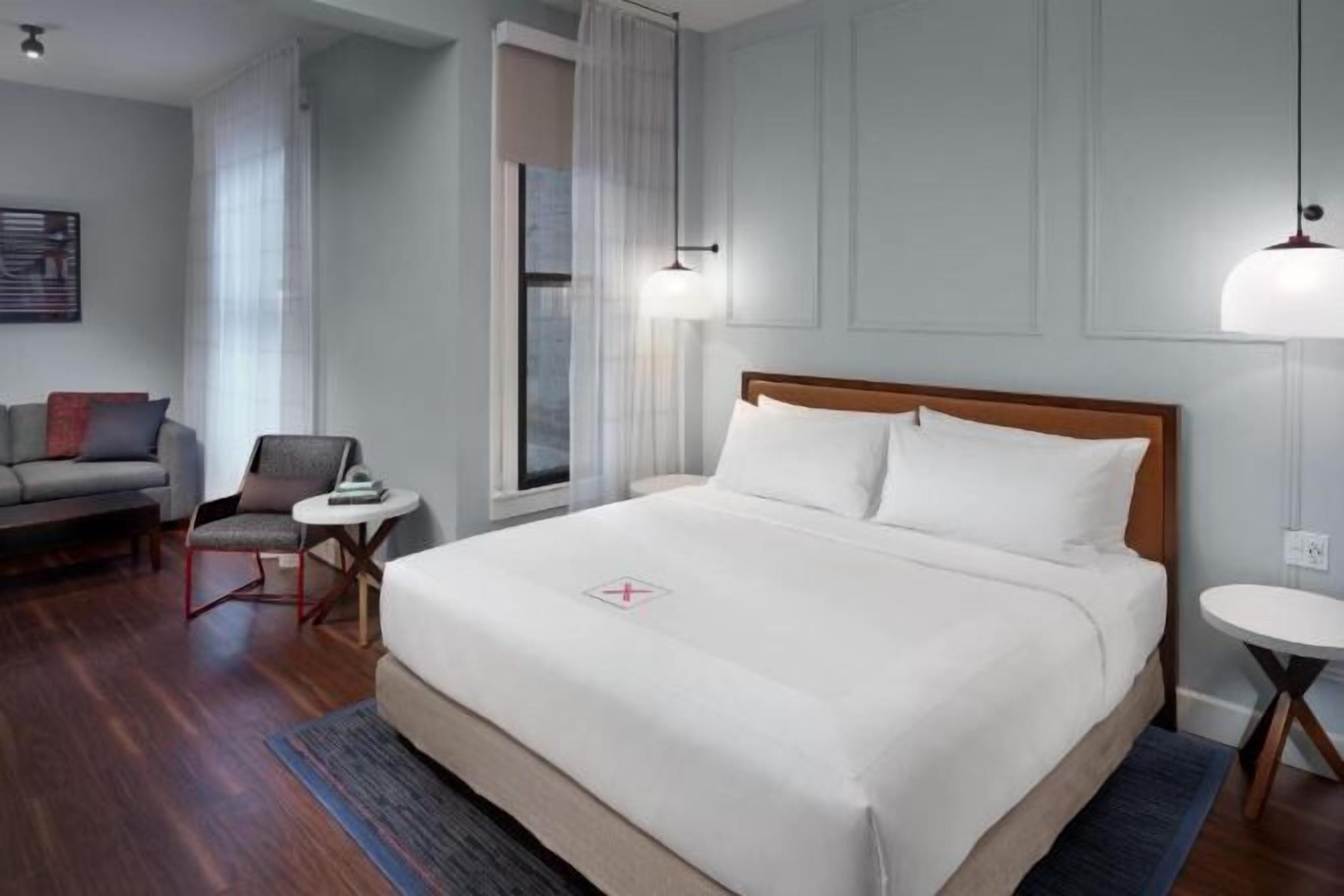 Premium bedding, down comforters, pillowtop beds, in-room safe