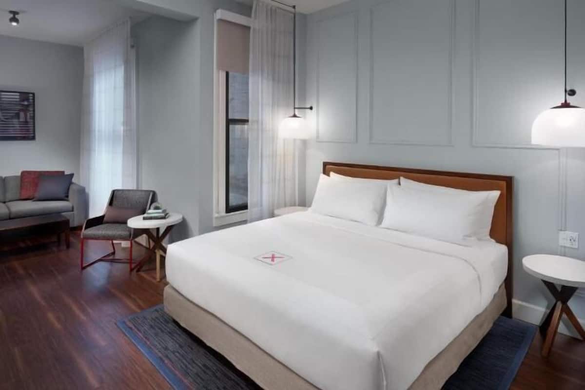 Premium bedding, down comforters, pillowtop beds, in-room safe