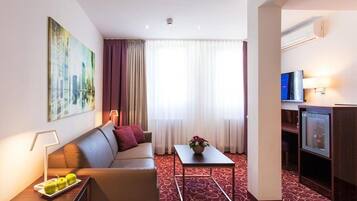 Hypoallergeen beddengoed, een minibar, een bureau