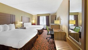 A hotel room with two beds, a desk, a chair, a mirror, and a large window. - Best Western Rochester Marketplace Inn (Rochester)