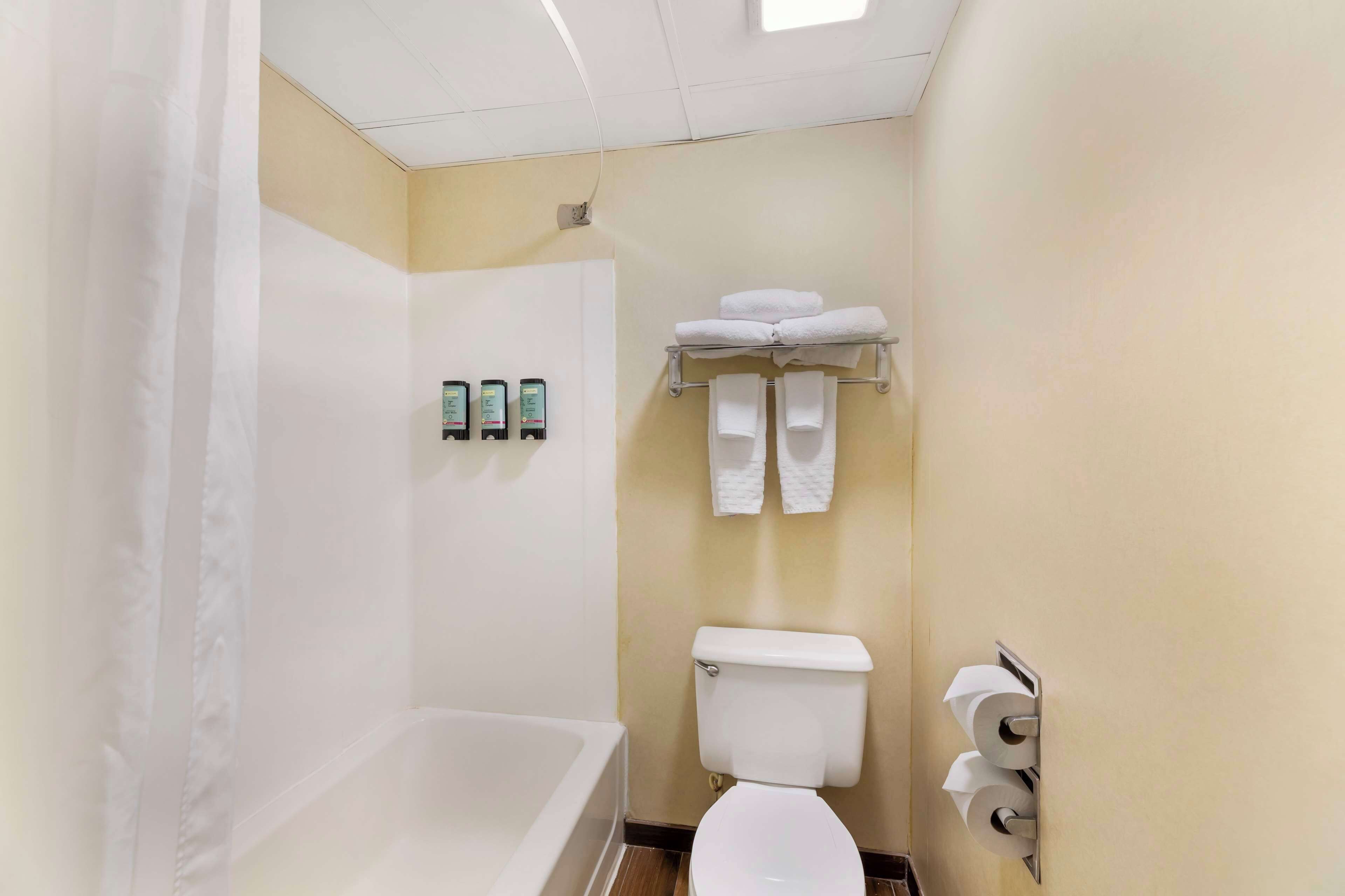 standard room, 2 queen beds, non smoking, refrigerator & microwave | bathroom | combined shower/bathtub, eco-friendly toiletries, hair dryer, towels