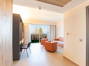 Suite, 1 King Bed, Sea View | Living area