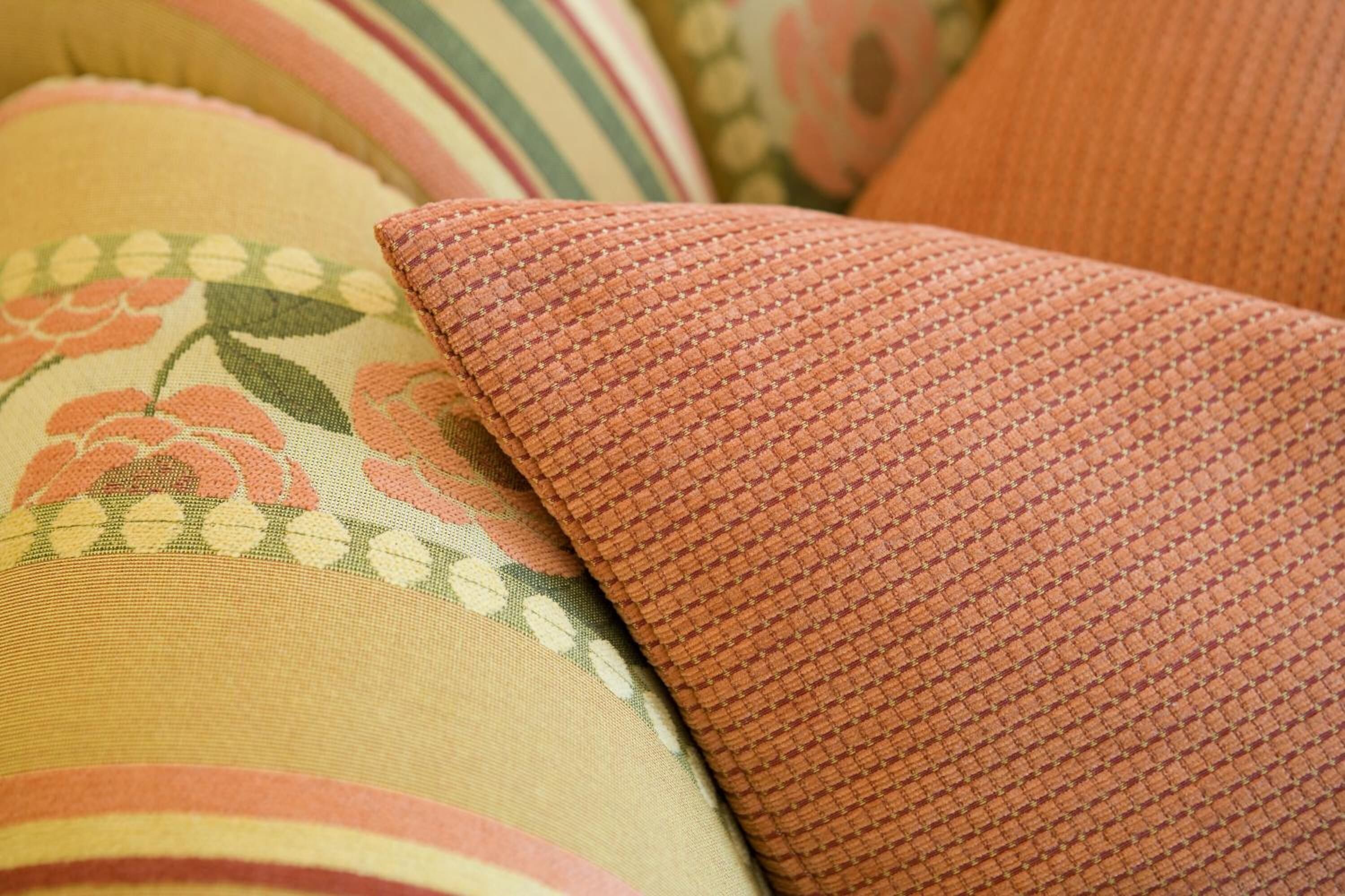 A close-up of a fabric with a floral pattern and a textured surface.
