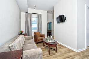 Executive Suite, 1 King Bed, Patio (Executive Suite-King & pullout sofa) | Living area | Flat-screen TV, tablet