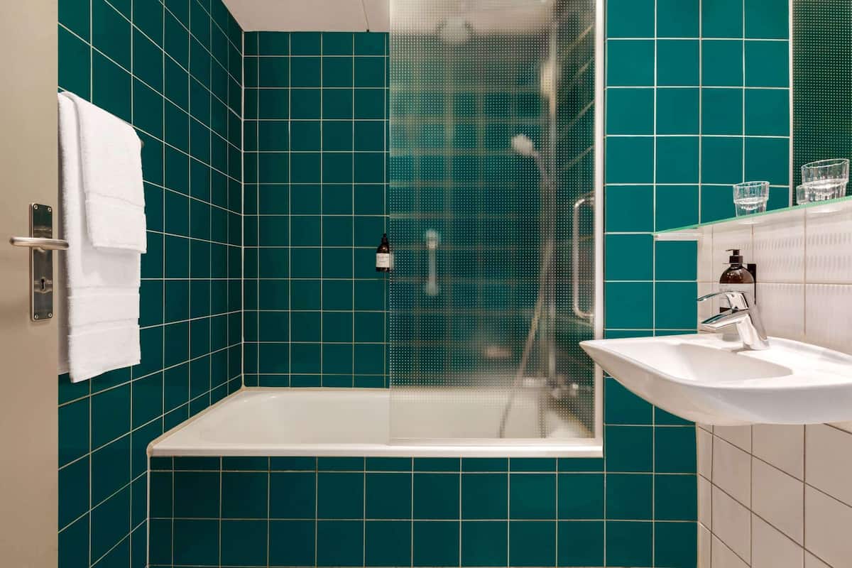 standard room, 1 single bed | bathroom | eco-friendly toiletries, hair dryer, towels