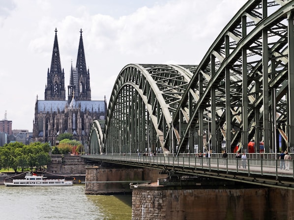 A large steel bridge with a Gothic cathedral in the background. - ibis Hotel Köln Centrum (Cologne)