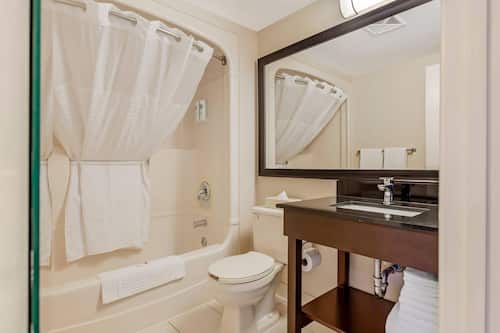 Standard Room, 2 Double Beds, Non Smoking, Ground Floor | Desk, laptop workspace, blackout curtains, iron/ironing board