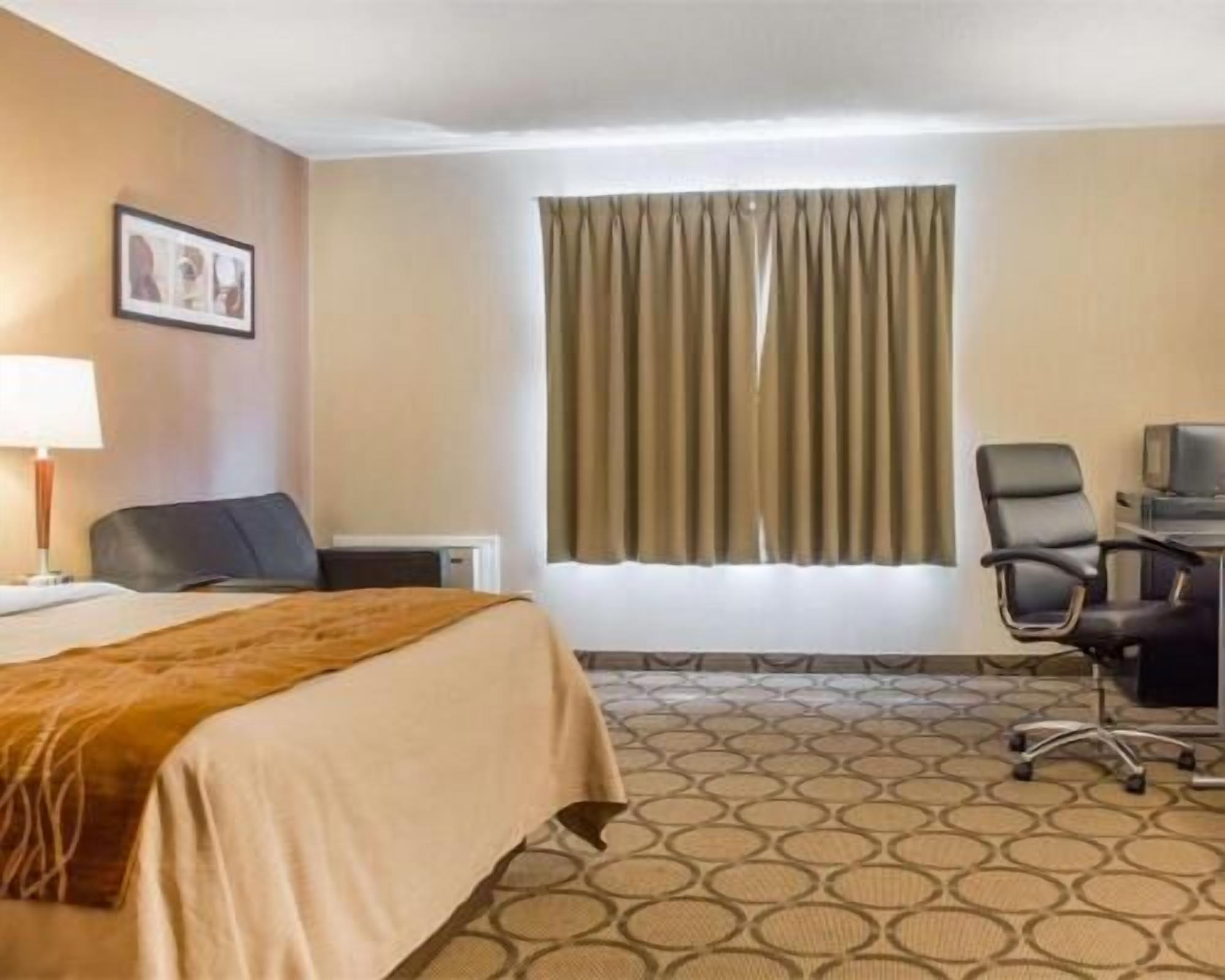 Desk, laptop workspace, blackout curtains, iron/ironing board