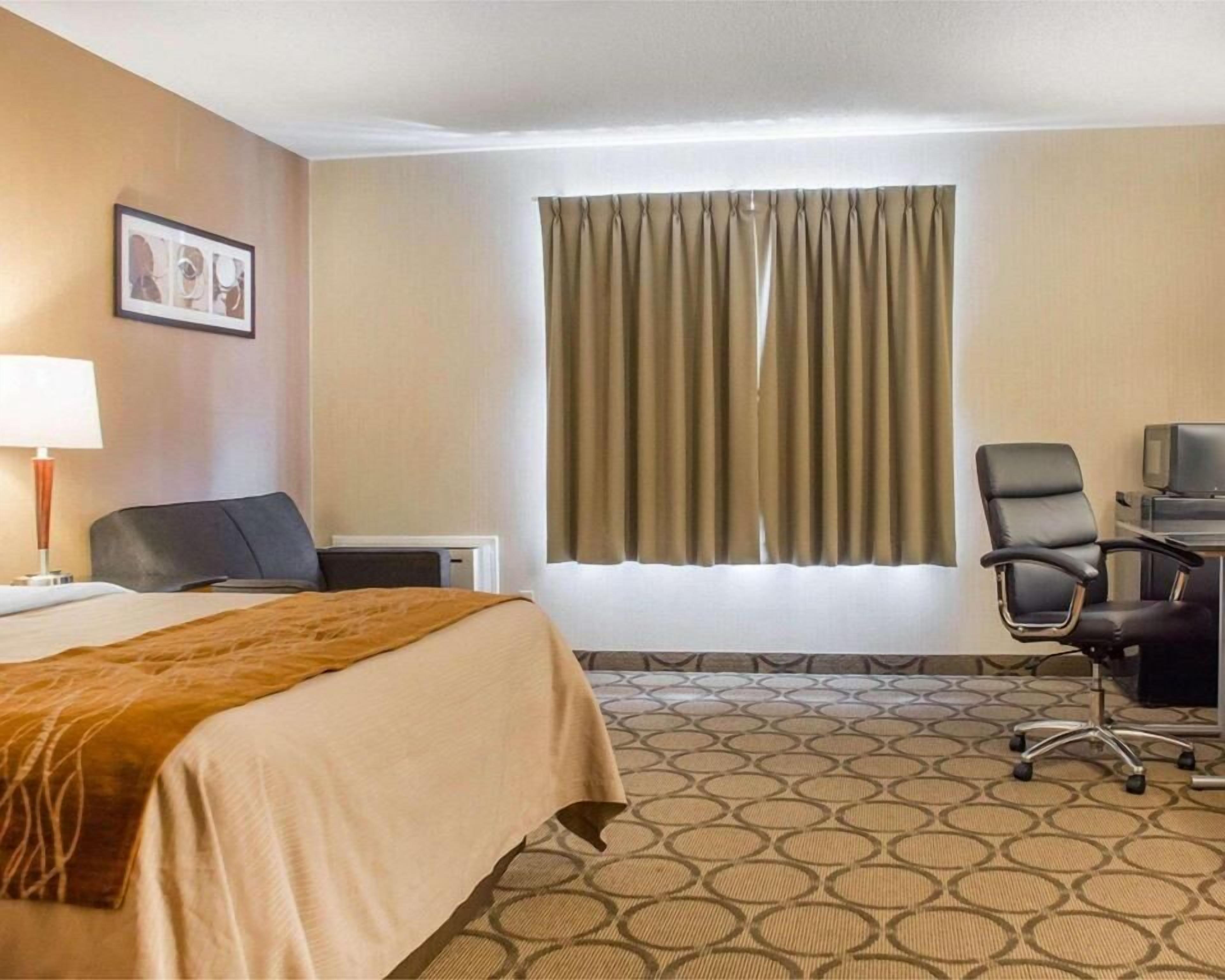 Desk, laptop workspace, blackout curtains, iron/ironing board