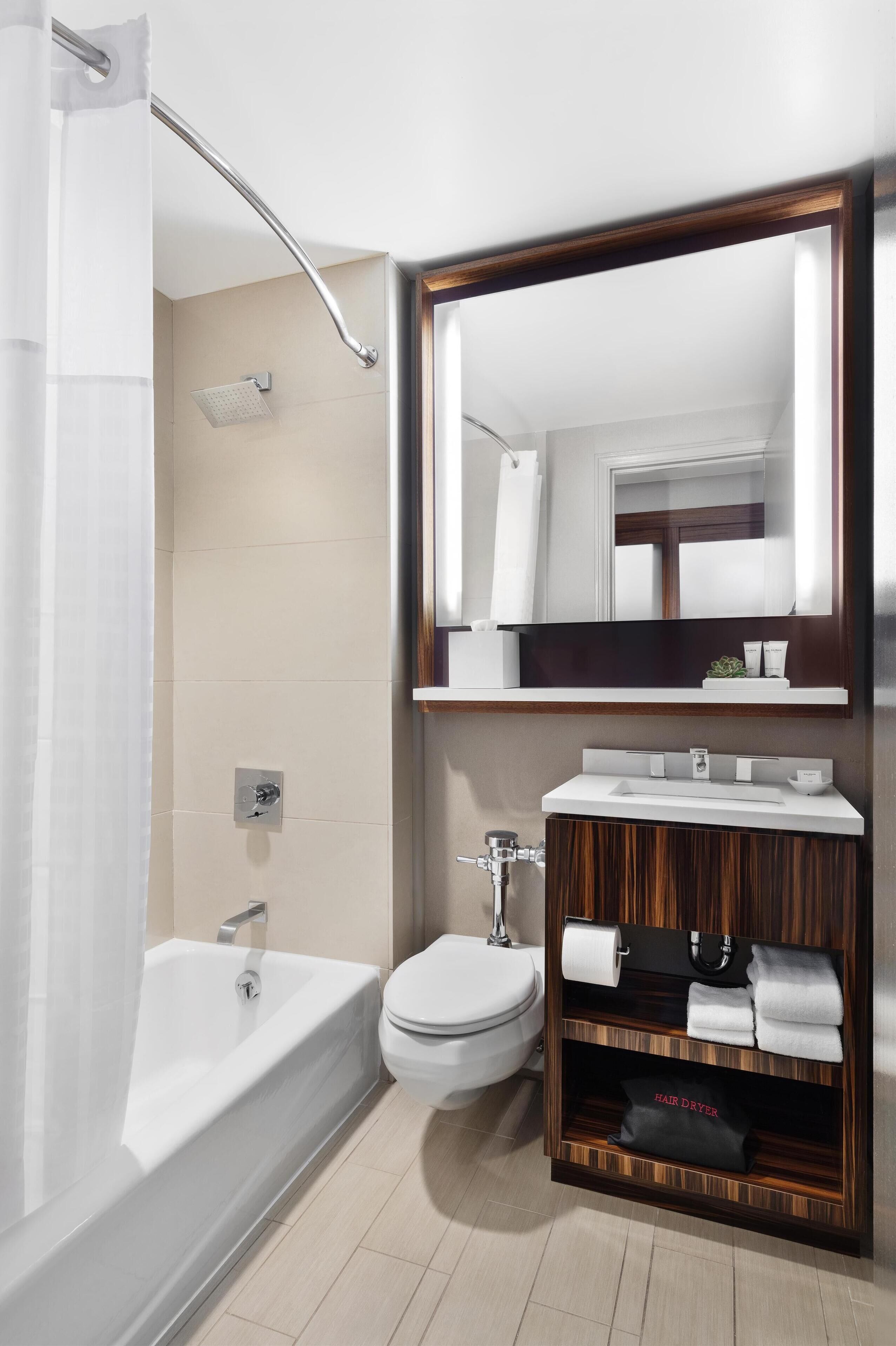 Designer toiletries, hair dryer, towels