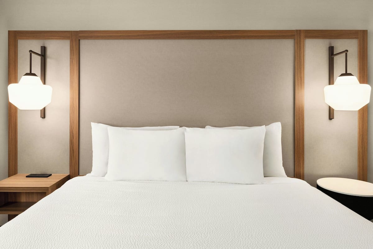 Hypo-allergenic bedding, desk, blackout drapes, iron/ironing board