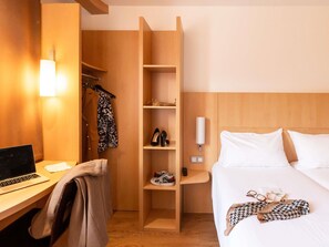 Premium bedding, pillowtop beds, desk, laptop workspace