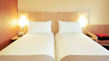 Premium bedding, pillow-top beds, desk, laptop workspace