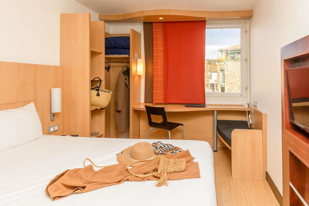 Premium bedding, pillow-top beds, desk, laptop workspace