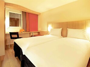 Premium bedding, pillow-top beds, desk, laptop workspace