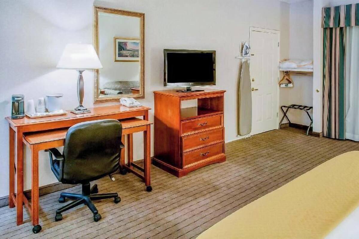 Desk, laptop workspace, blackout curtains, iron/ironing board