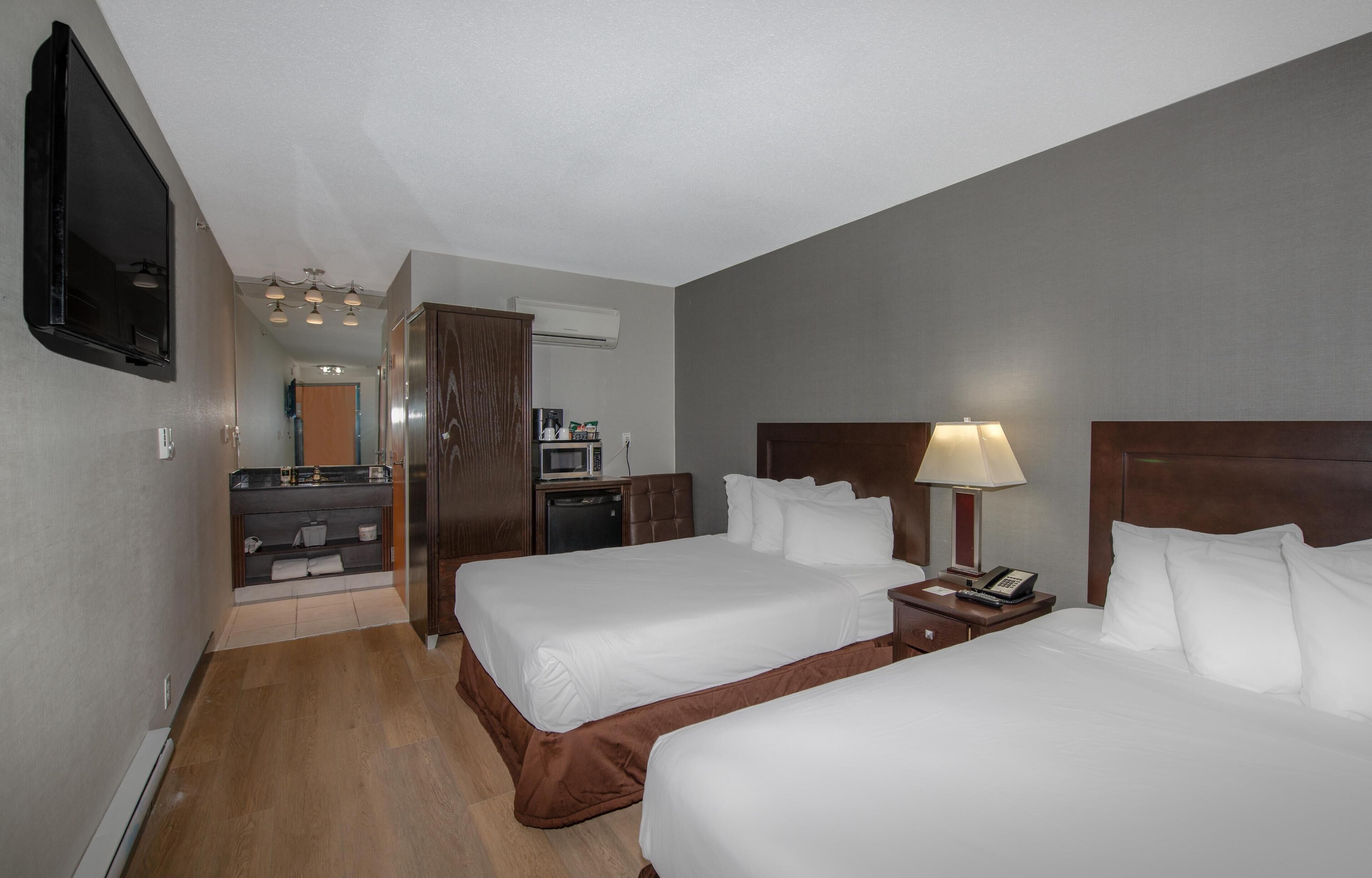 Basic Double Room | Premium bedding, down comforters, blackout drapes, iron/ironing board