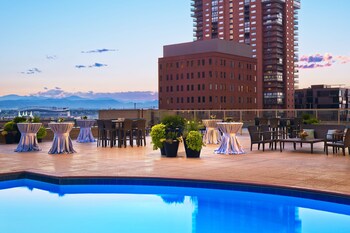 Indoor pool, outdoor pool, open 5:00 AM to 10:00 PM, sun loungers at The Westin Denver Downtown