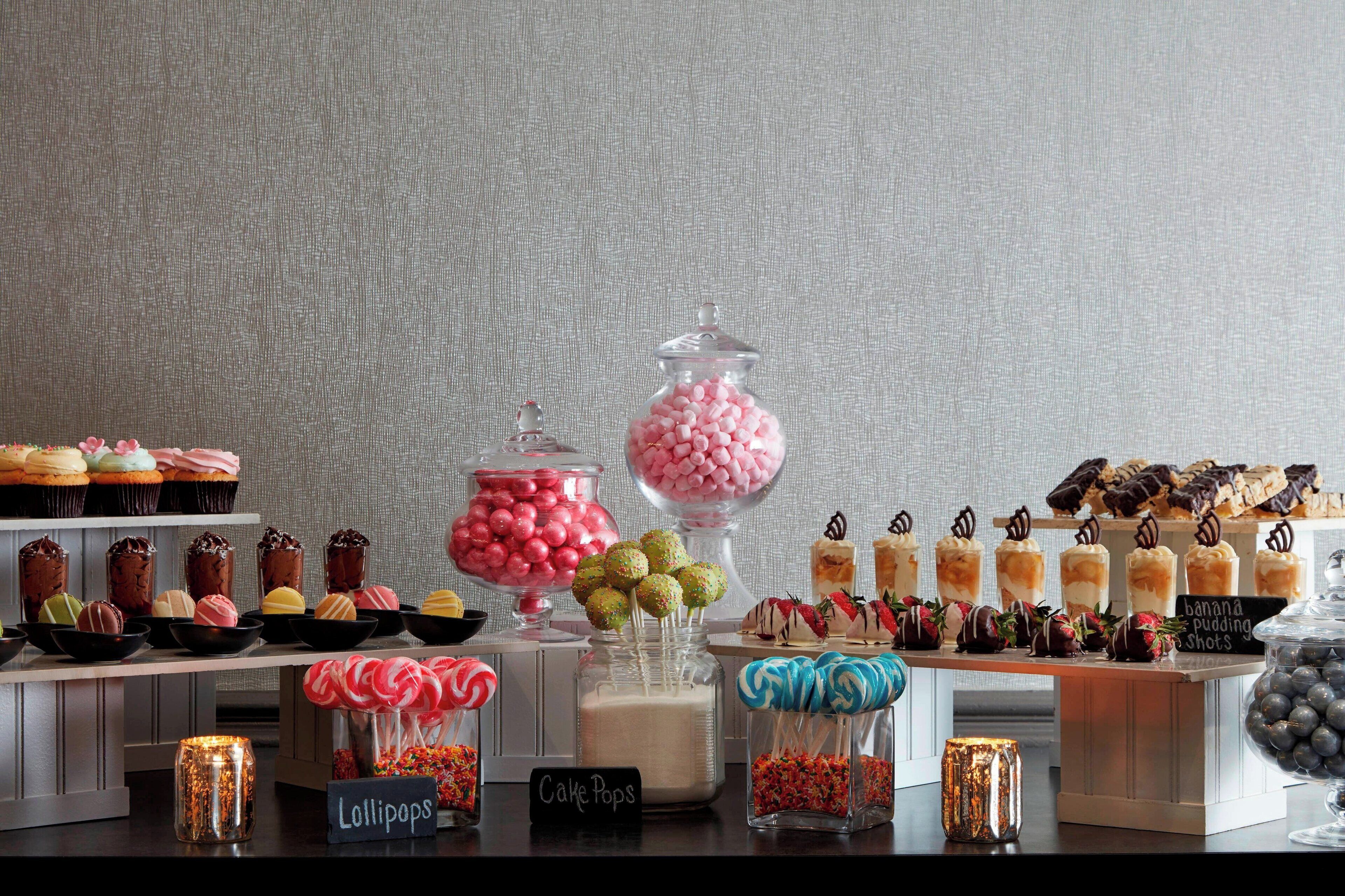 A dessert display with various sweets and treats.