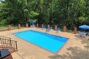 Seasonal outdoor pool, open 11:00 AM to 9:00 PM, pool loungers