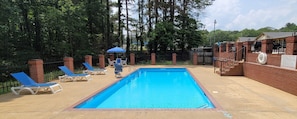 Seasonal outdoor pool, open 11:00 AM to 9:00 PM, pool umbrellas