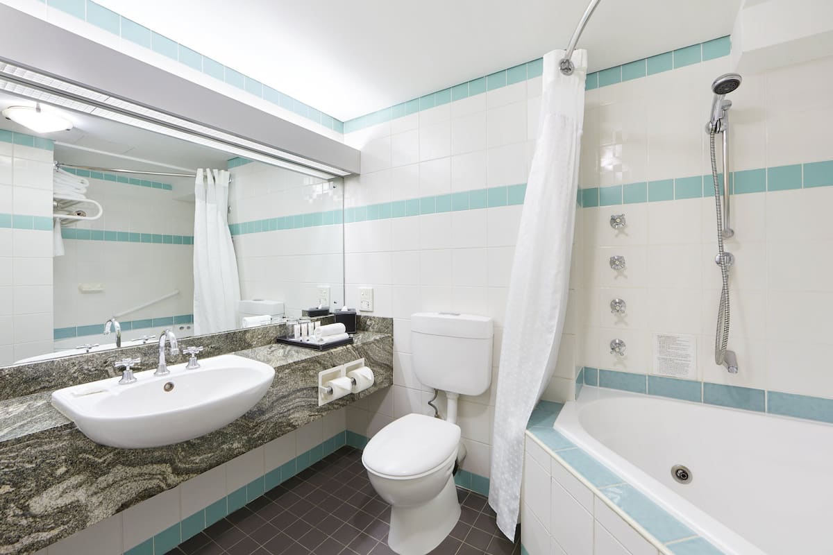 suite, 1 king bed | bathroom | free toiletries, hair dryer, towels, soap