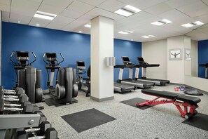 A gym with treadmills, elliptical machines, and free weights. - Durham Marriott City Center (Durham)