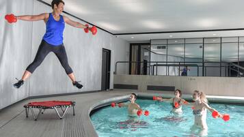 Indoor pool, open 8:00 AM to 8:30 PM, pool loungers, lifeguards on site