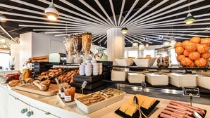 A buffet with various food items, including pastries, fruits, and condiments. - Ibis Styles La Rochelle Thalasso Châtelaillon (Chatelaillon-Plage)