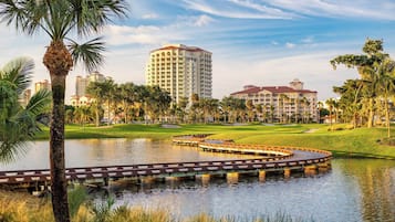 Stroll across the serene water feature and enjoy the lush surroundings.