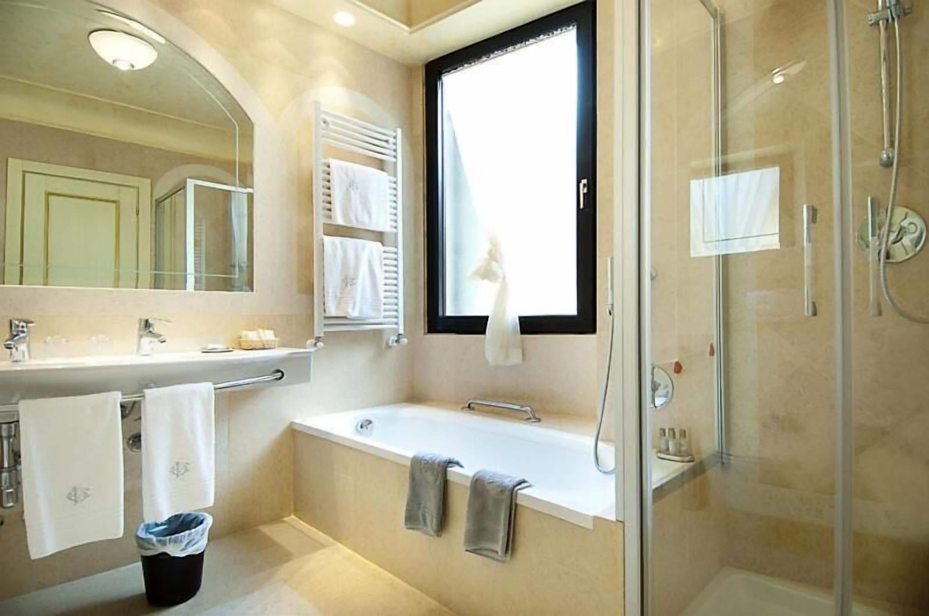 superior double or twin room | bathroom | bathtub, free toiletries, hair dryer, slippers