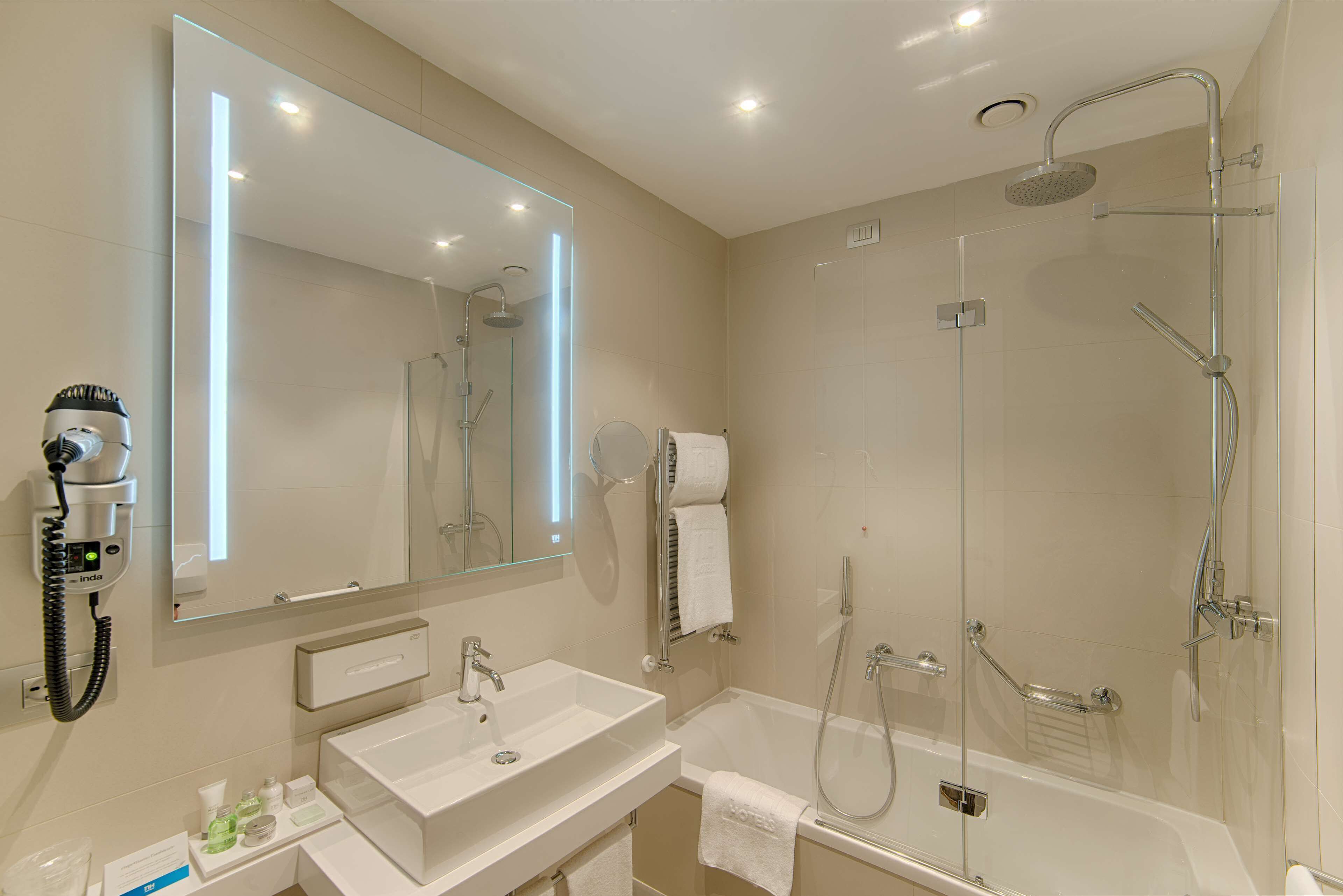 eco-friendly toiletries, hair dryer, slippers, bidet