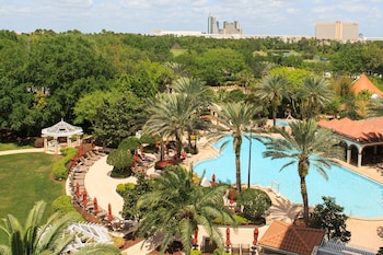 Outdoor pool, open 6:30 AM to 11:00 PM, pool umbrellas, sun loungers at Renaissance Orlando at SeaWorld