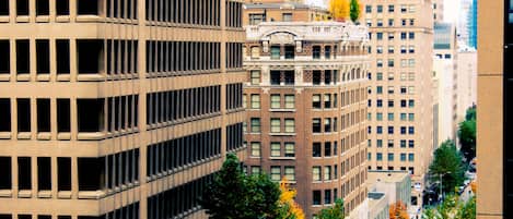 A high-rise building with a grid of windows and a central entrance.