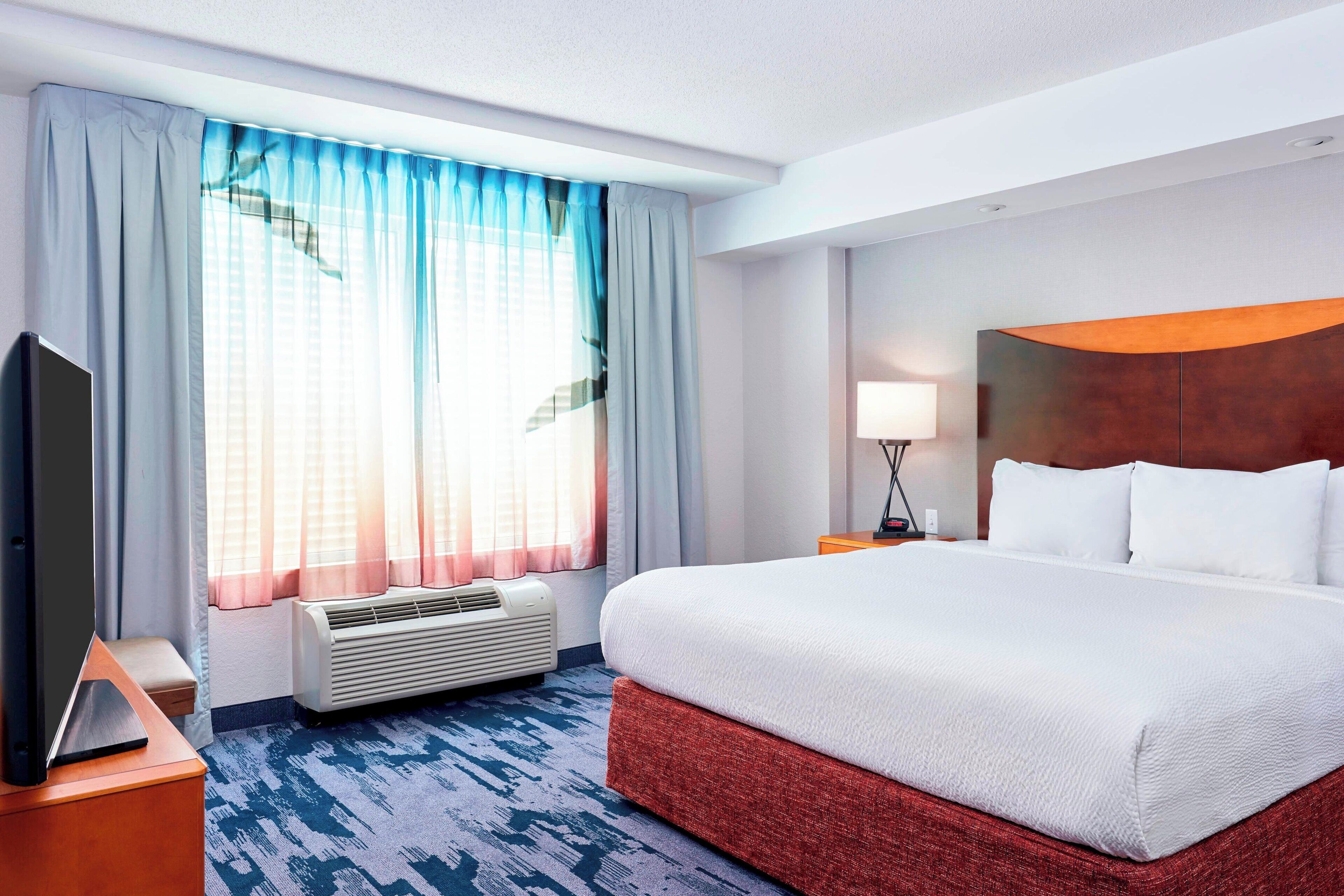 premium bedding, down duvets, desk, blackout curtains